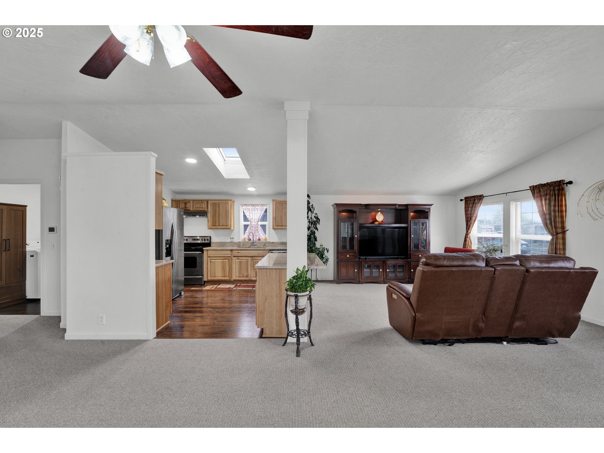 346 East 10th Place Junction City, OR 97448 - Photo 7 of 39 a living room with furniture and a flat screen tv