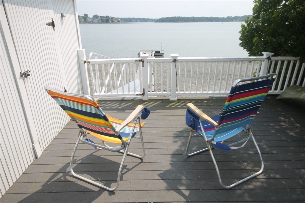 57 Edgewater Road Hull, MA 02045 - Photo 2 of 41 a backyard of a house with outdoor seating