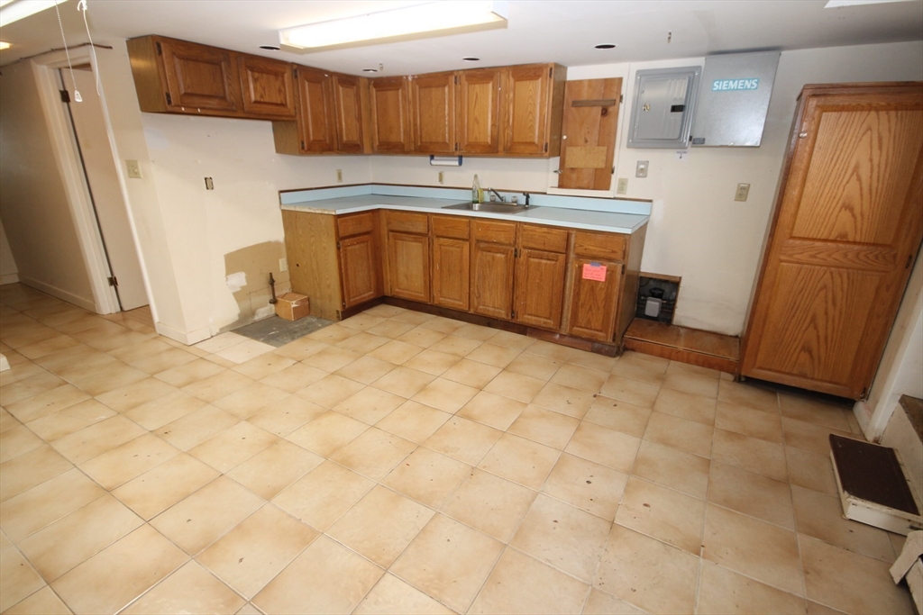 57 Edgewater Road Hull, MA 02045 - Photo 31 of 41 a kitchen with stainless steel appliances granite countertop a refrigerator and a sink