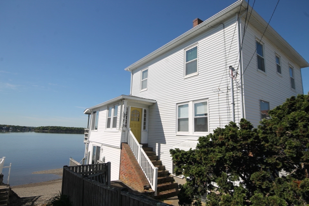 57 Edgewater Road Hull, MA 02045 - Photo 5 of 41 a front view of a house with lake view