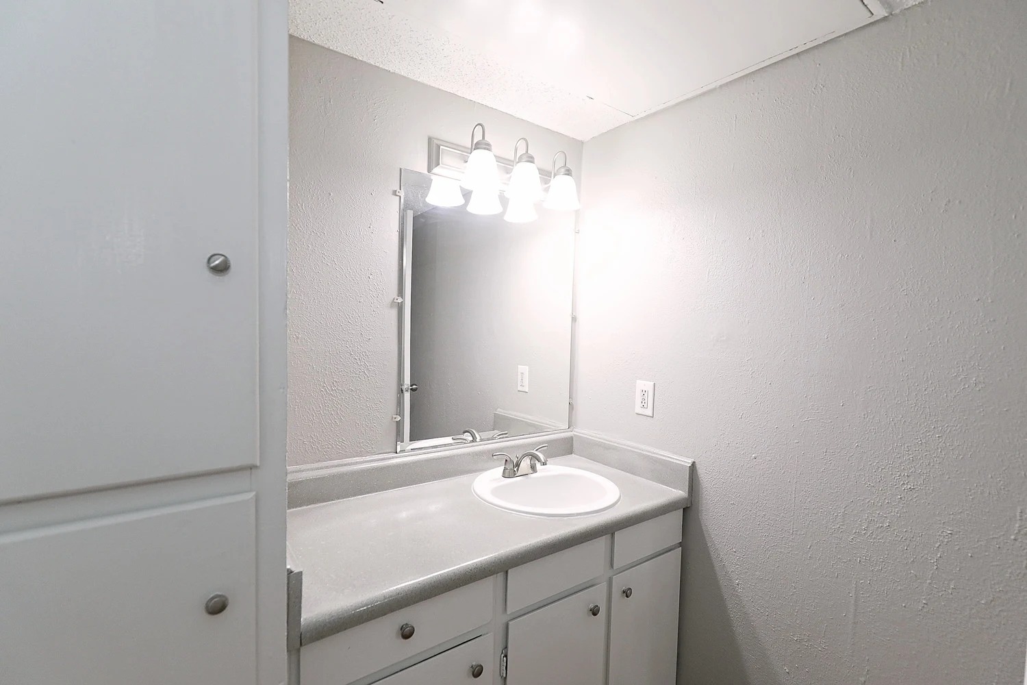 8100 North Mopac Expressway, Unit 17171 Austin, TX 78759 - Photo 16 of 22 Bathroom with a textured wall and vanity
