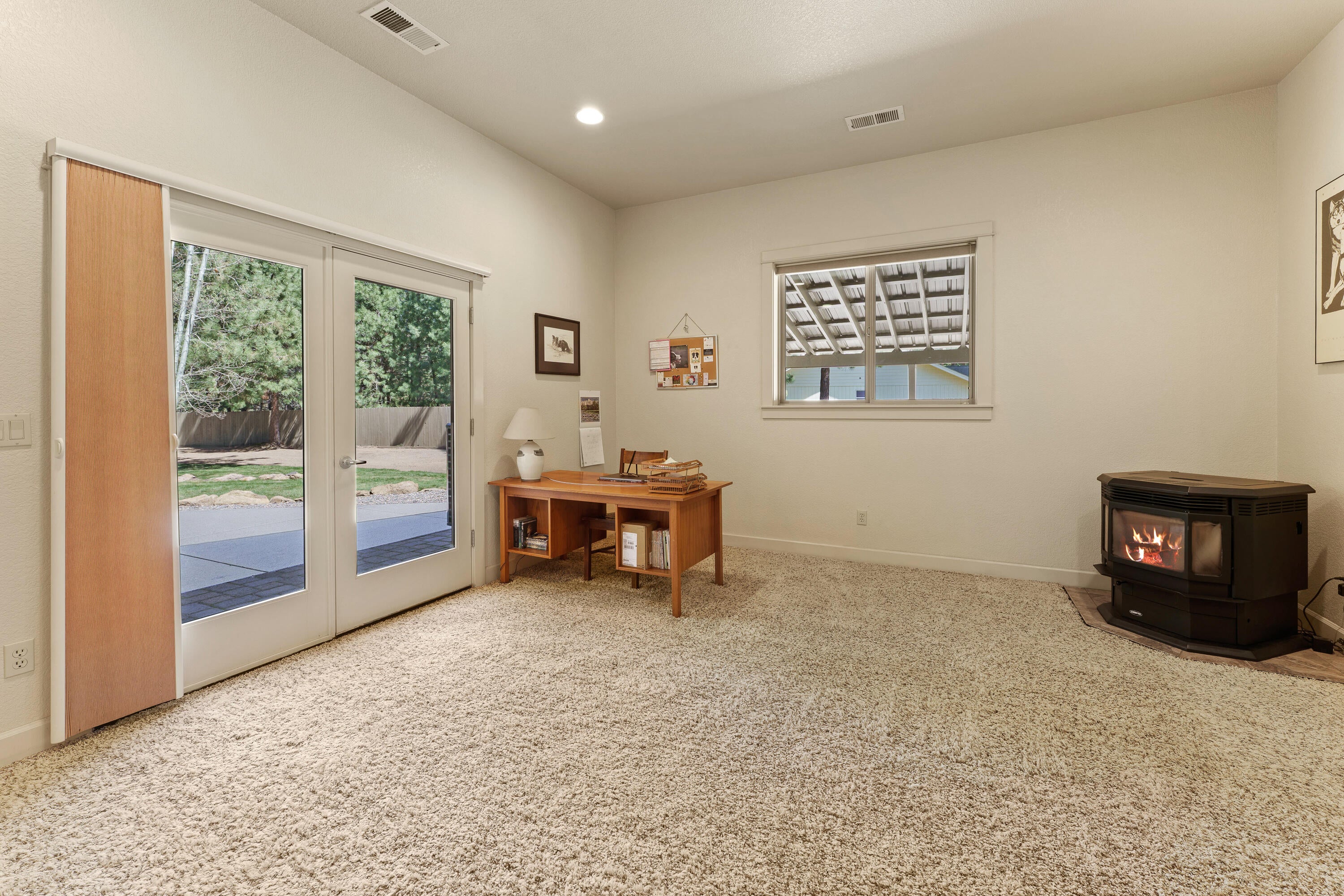 19236 Kiowa Road Bend, OR 97702 - Photo 35 of 52 Bonus space with pellet stove with separate entrance to backyard