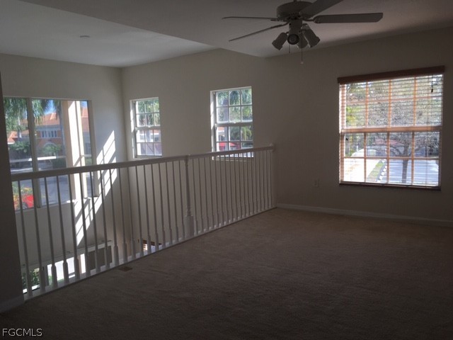 4500 Botanical Pl Circle, Unit 107 Naples, FL 34112 - Photo 27 of 39 an empty room with windows