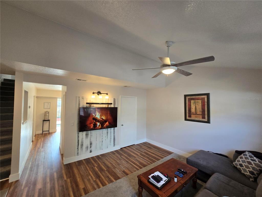 820 West 25th Street Sanford, FL 32771 - Photo 8 of 23 a living room with furniture and a flat screen tv