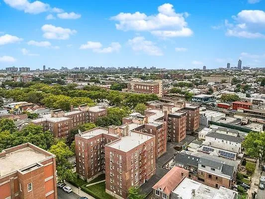 an aerial view of a city with lots of residential buildings