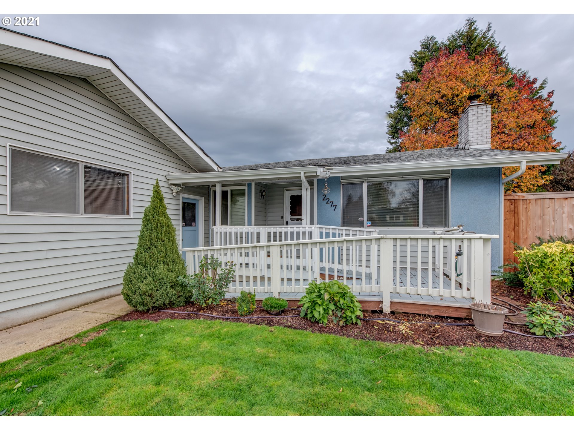 2277 11th Street Springfield, OR 97477 - Photo 2 of 24 a front view of a house with a garden