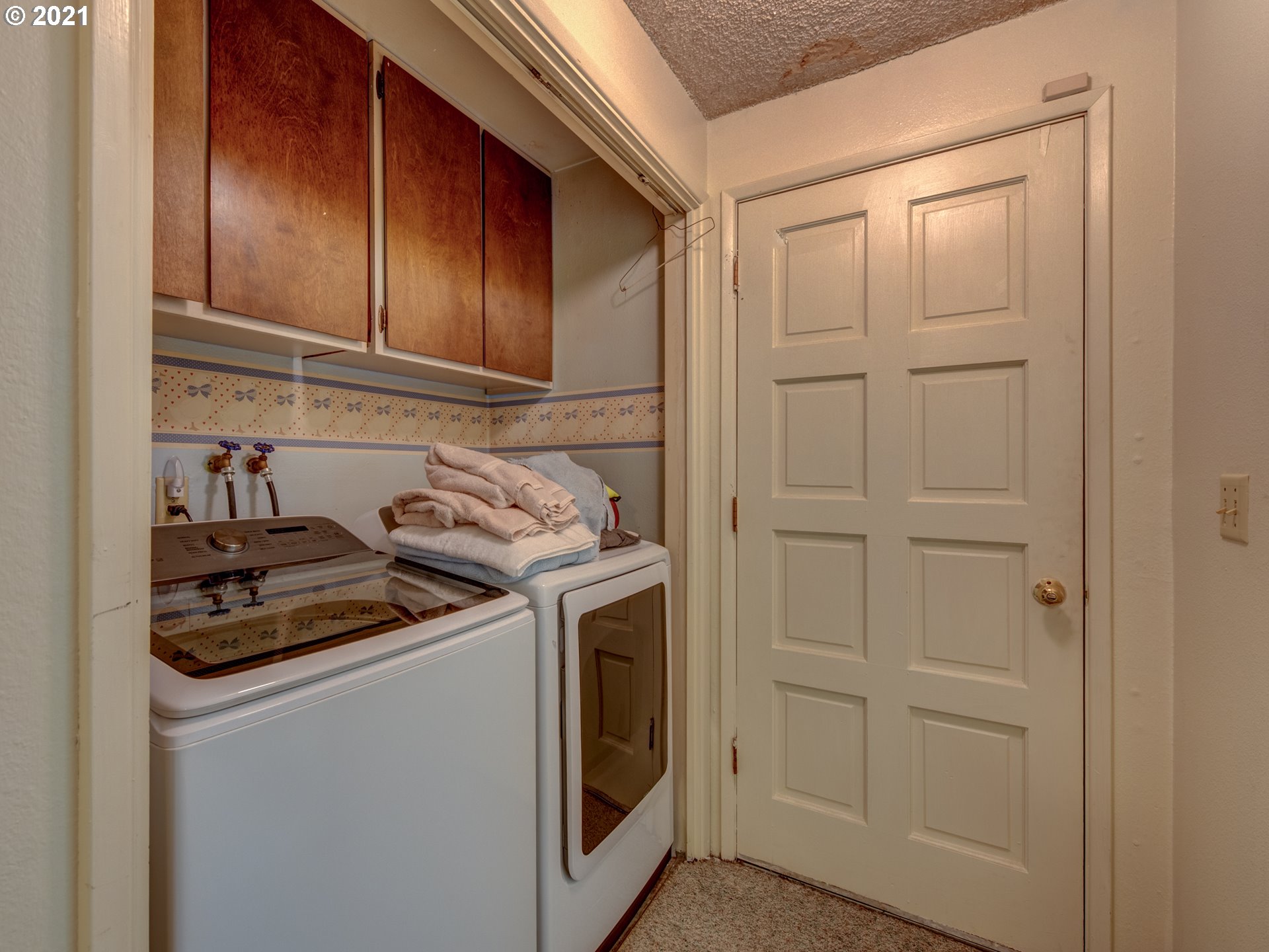 2277 11th Street Springfield, OR 97477 - Photo 18 of 24 a kitchen with white cabinets and sink
