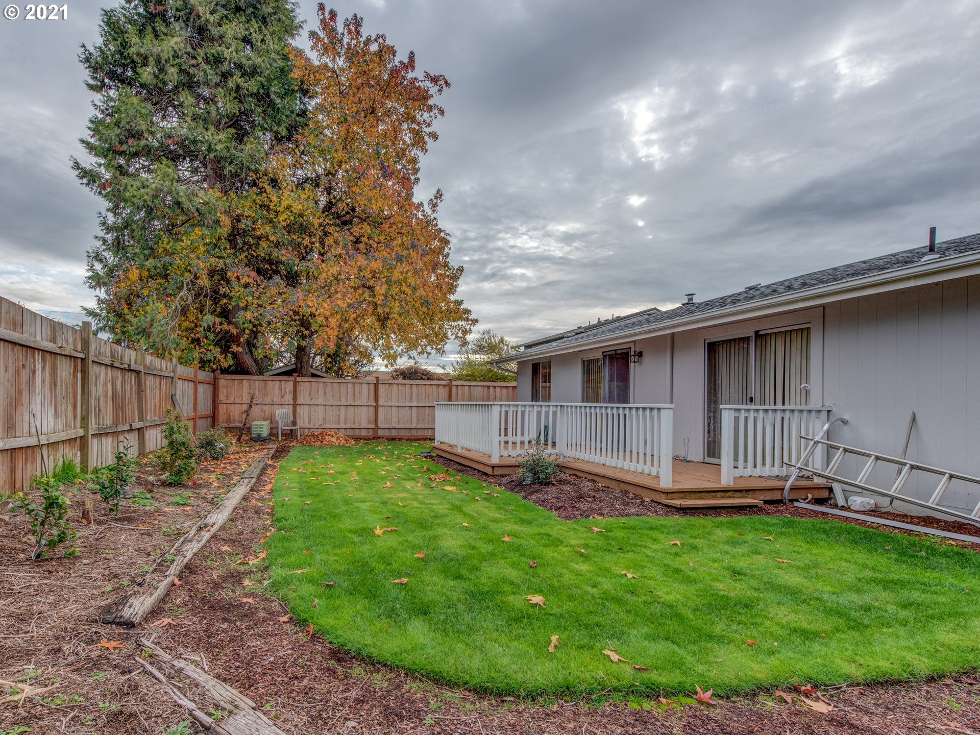 2277 11th Street Springfield, OR 97477 - Photo 20 of 24 a view of a backyard with a garden