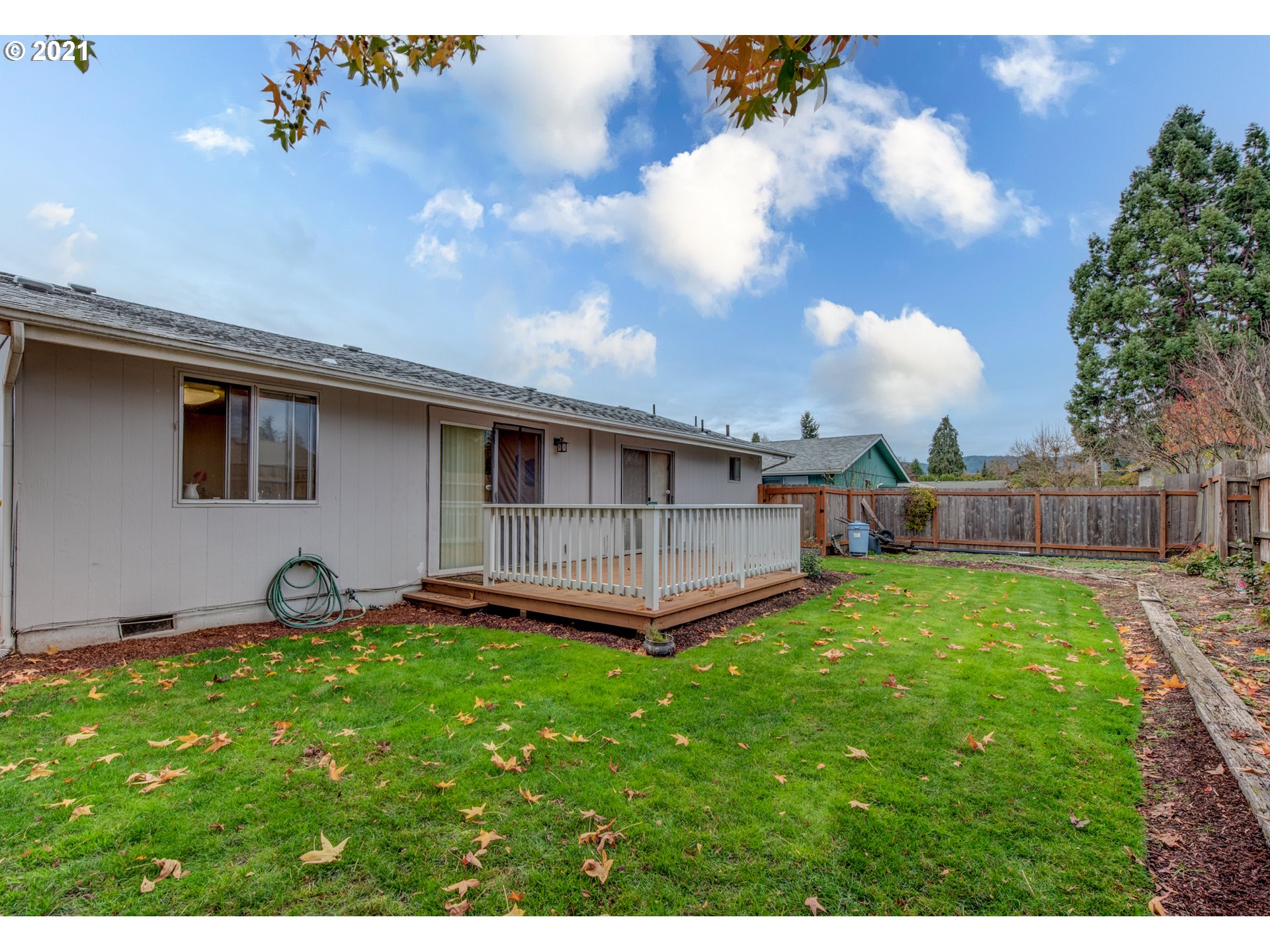 2277 11th Street Springfield, OR 97477 - Photo 21 of 24 a backyard of a house with table and chairs