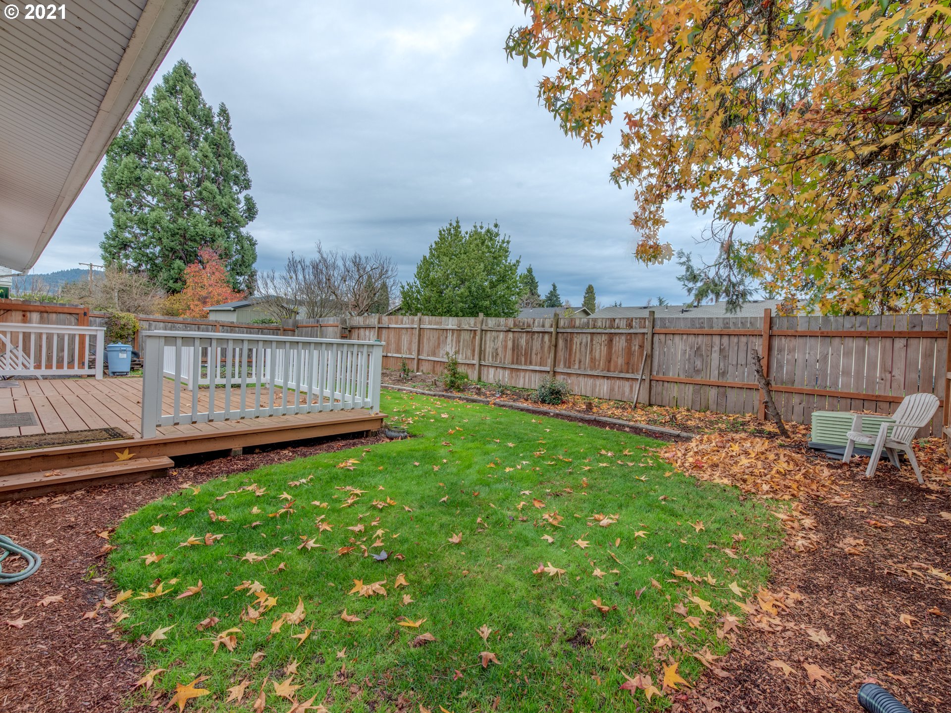 2277 11th Street Springfield, OR 97477 - Photo 22 of 24 a view of a deck with a big yard