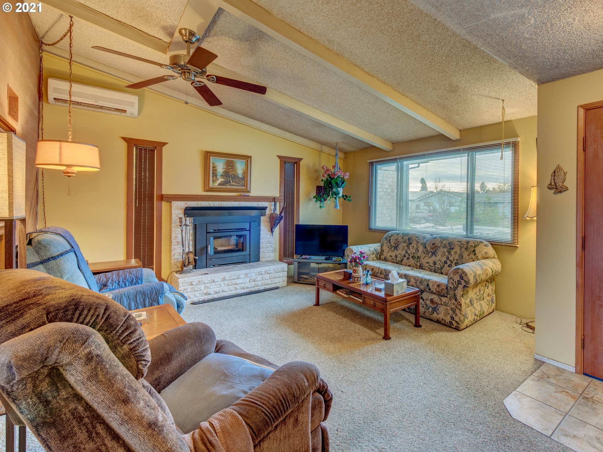 2277 11th Street Springfield, OR 97477 - Photo 5 of 24 a living room with furniture and a fireplace