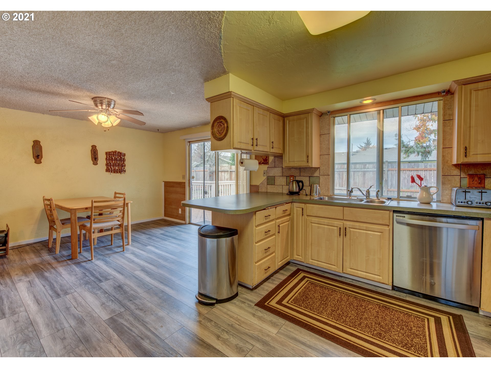 2277 11th Street Springfield, OR 97477 - Photo 7 of 24 a kitchen with sink and cabinets
