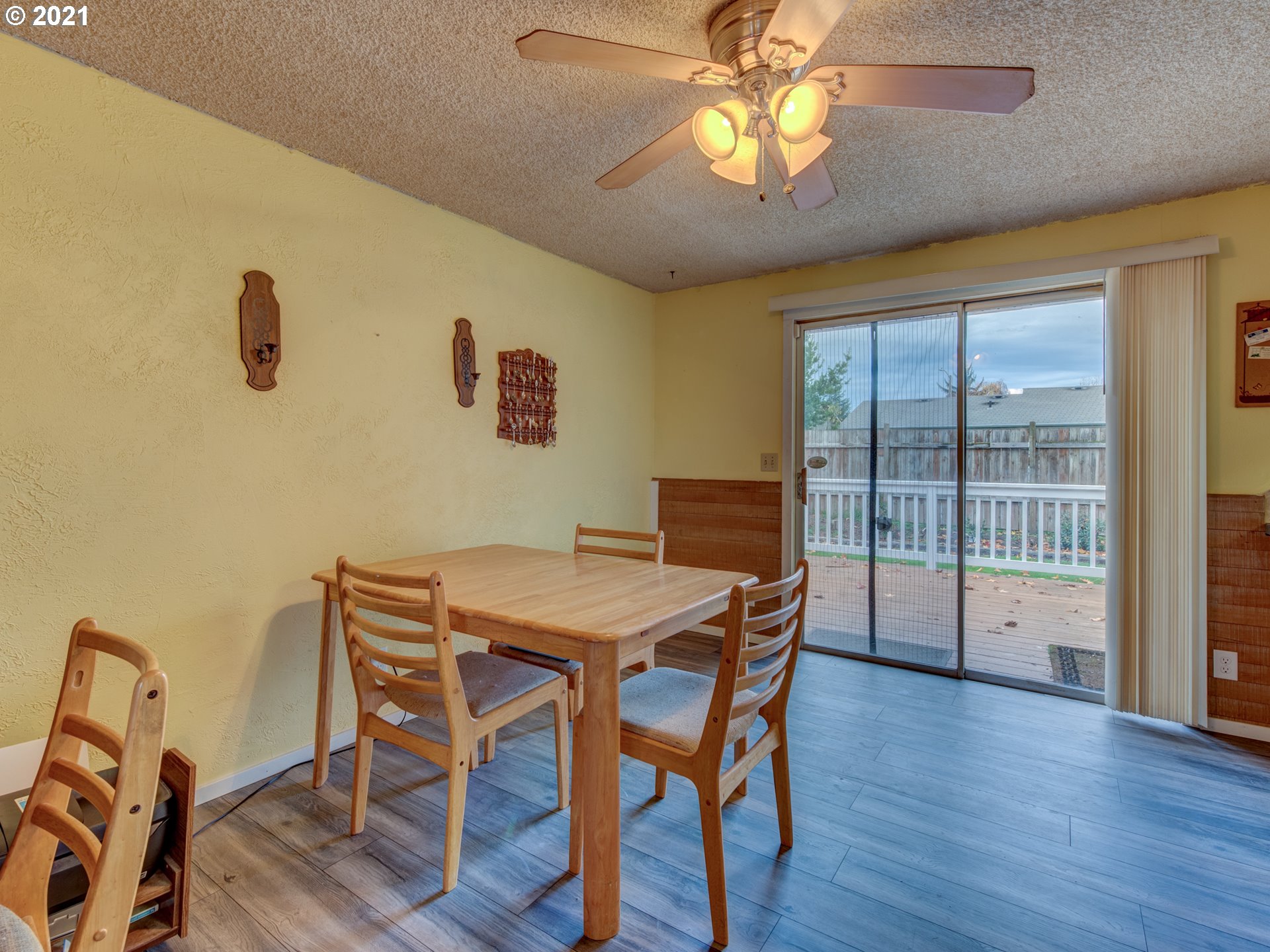 2277 11th Street Springfield, OR 97477 - Photo 10 of 24 a view of a dining room with furniture and wooden floor
