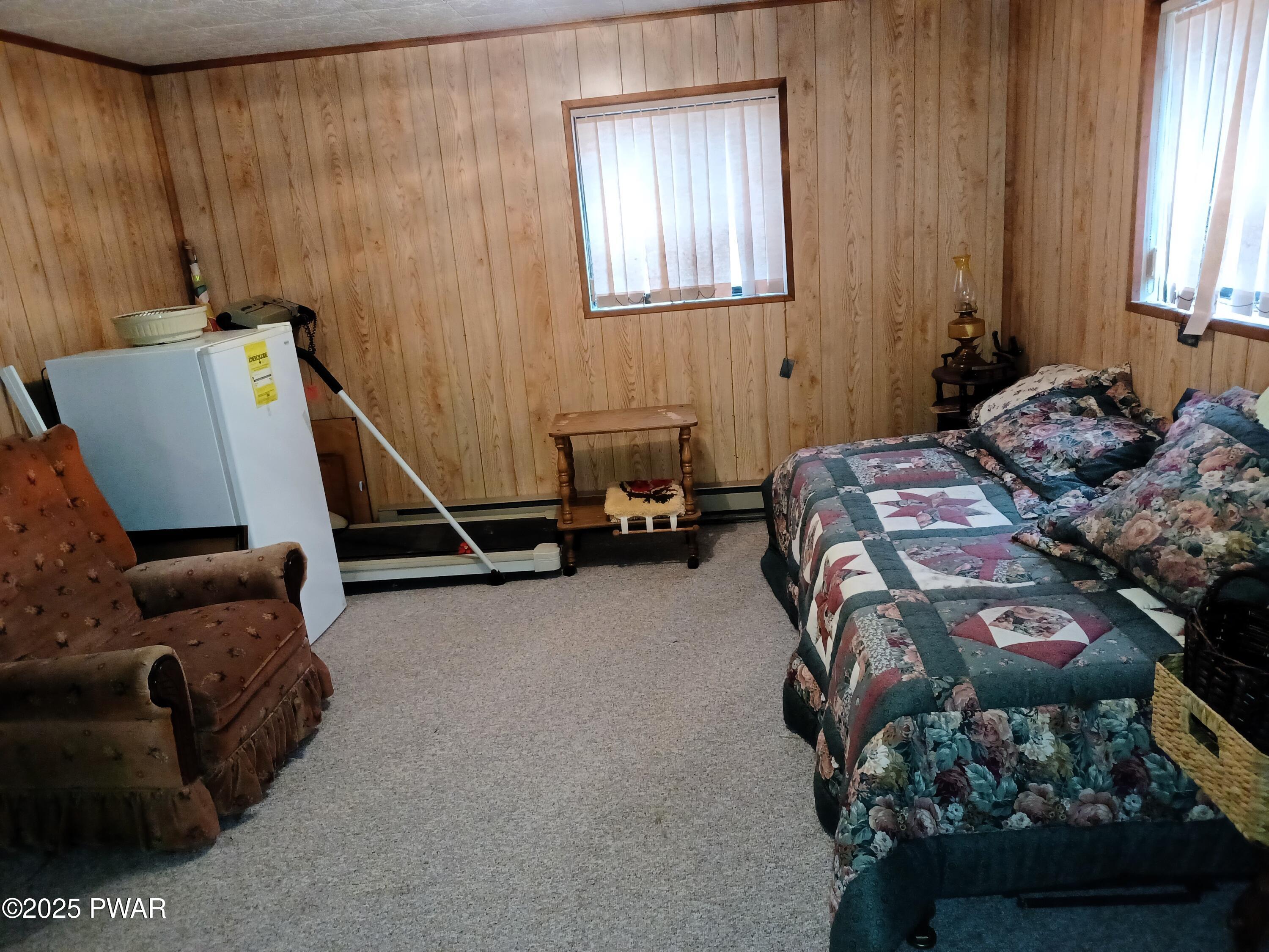 540 Northgate Road Lake Ariel, PA 18436 - Photo 23 of 40 a bedroom with bed and a couch