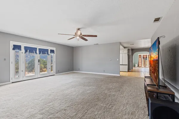 a view of livingroom with furniture window and wooden floor
