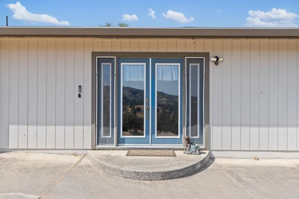 a view of a door and a window