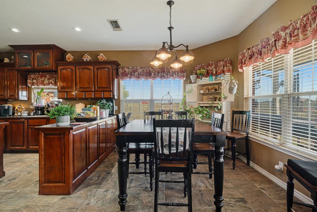 600 County Road Deport, TX 75435 - Photo 16 of 34 a view of a dining room with furniture window and wooden floor