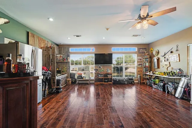 a spacious bathroom with a double vanity sink and a mirror