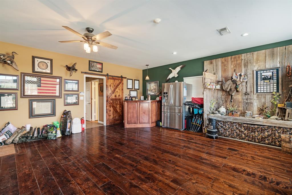 600 County Road Deport, TX 75435 - Photo 22 of 34 a view of a livingroom with furniture wooden floor and windows