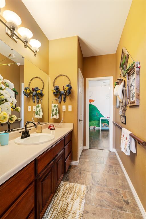 600 County Road Deport, TX 75435 - Photo 25 of 34 a spacious bathroom with a double vanity sink and a mirror