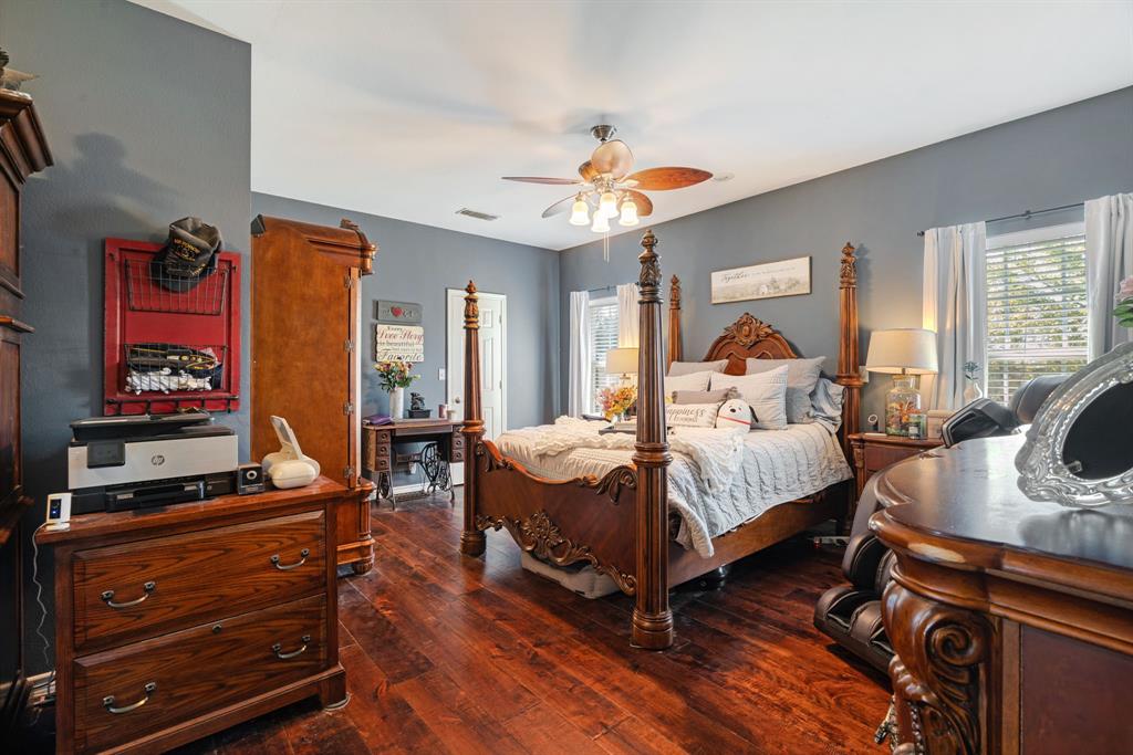 600 County Road Deport, TX 75435 - Photo 28 of 34 a bedroom with a bed and wooden floor
