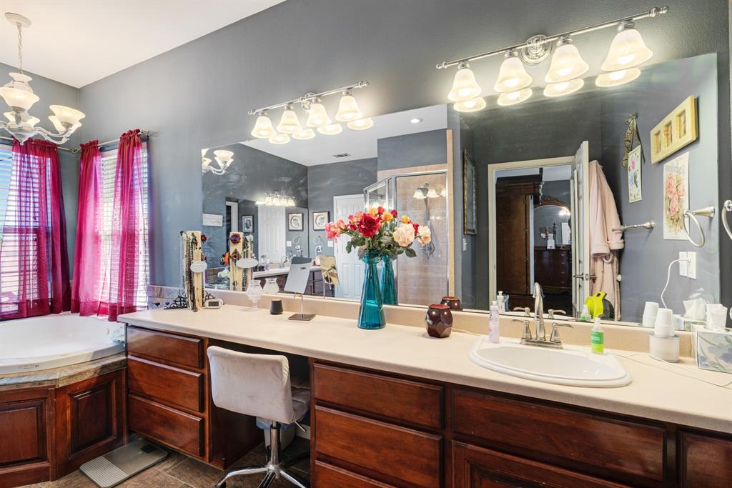 600 County Road Deport, TX 75435 - Photo 30 of 34 a bathroom with a sink double vanity and a mirror