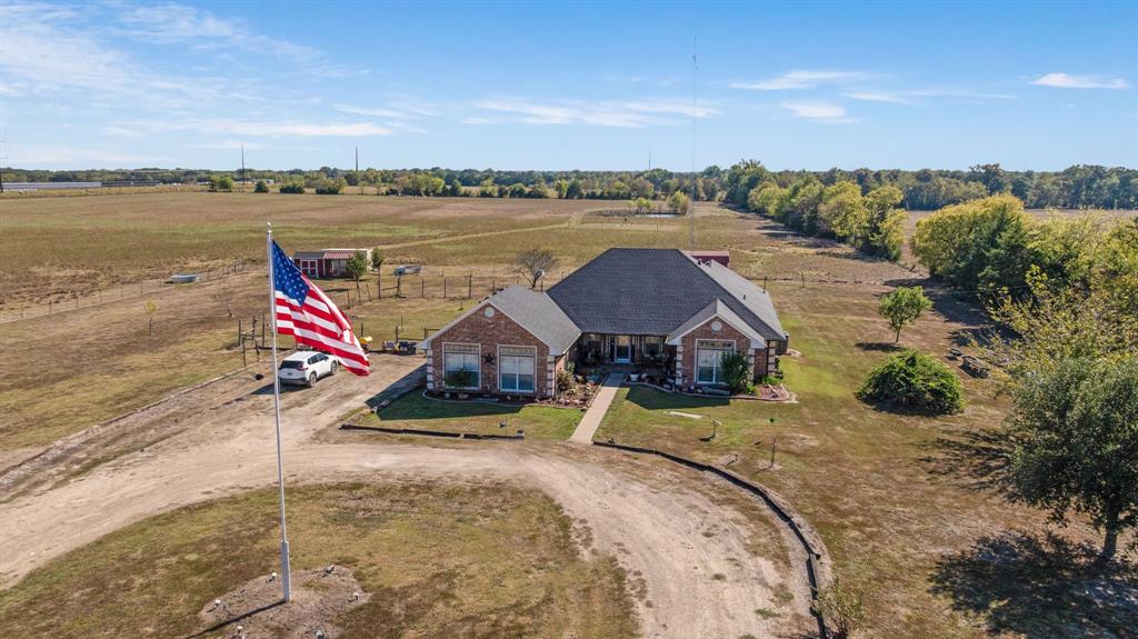 600 County Road Deport, TX 75435 - Photo 3 of 34 an aerial view of a house with swimming pool and patio