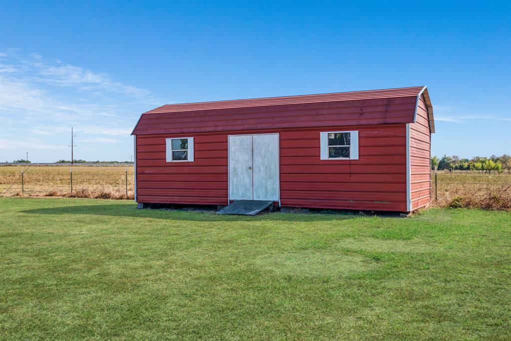 600 County Road Deport, TX 75435 - Photo 33 of 34 a view of a backyard with barn plants