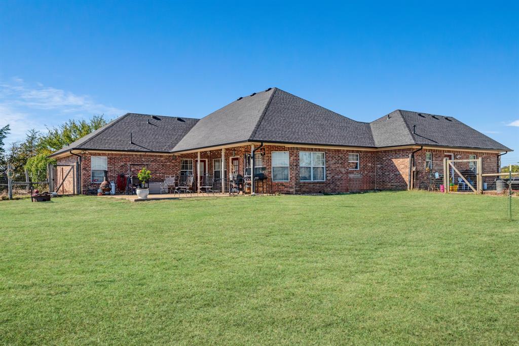 600 County Road Deport, TX 75435 - Photo 4 of 34 a front view of a house with garden