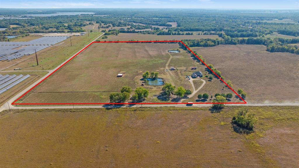 600 County Road Deport, TX 75435 - Photo 6 of 34 an aerial view of a house with a yard and lake view