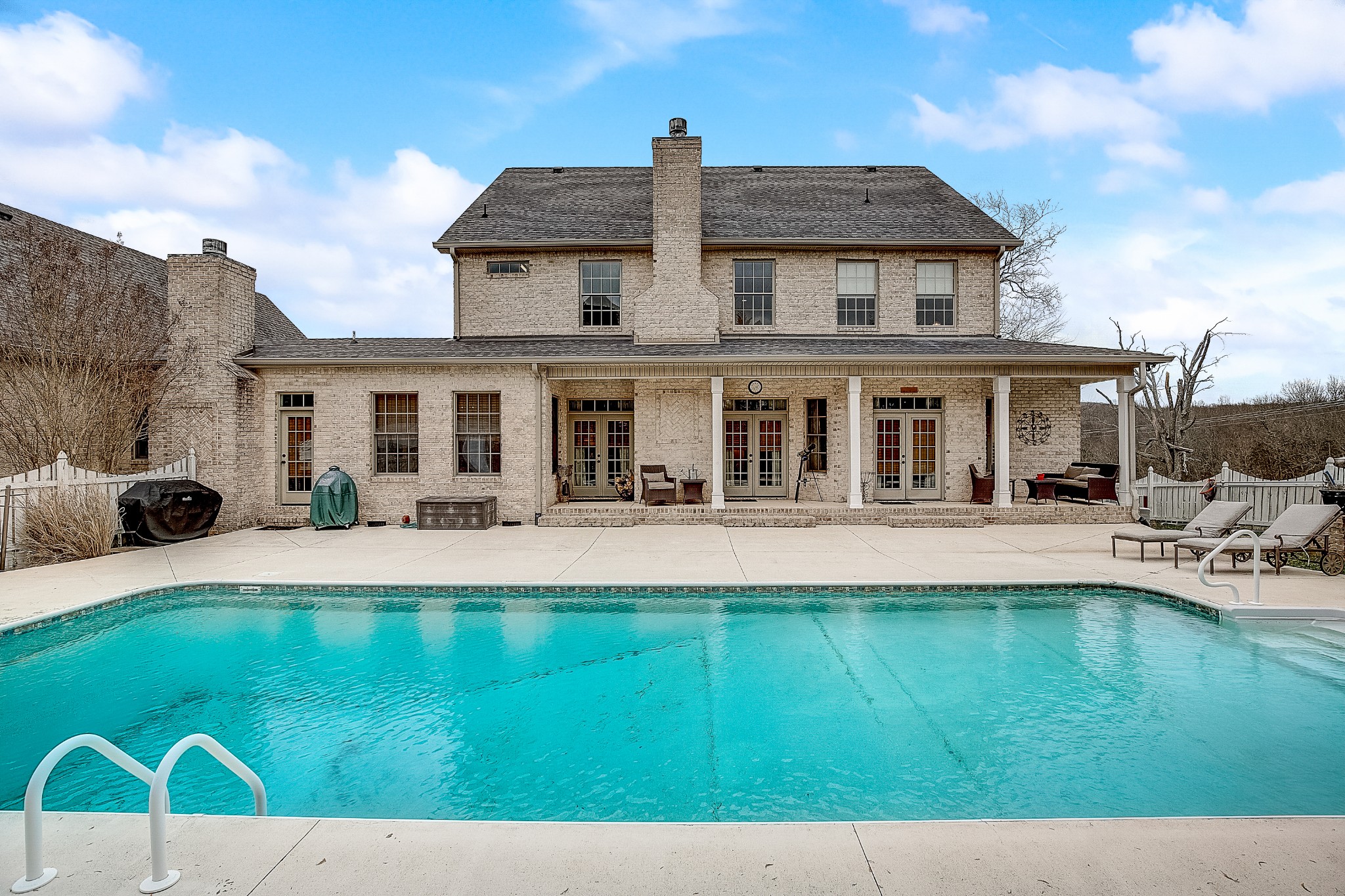 10900 Versailles Road Rockvale, TN 37153 - Photo 36 of 56 a front view of a house with swimming pool having outdoor seating