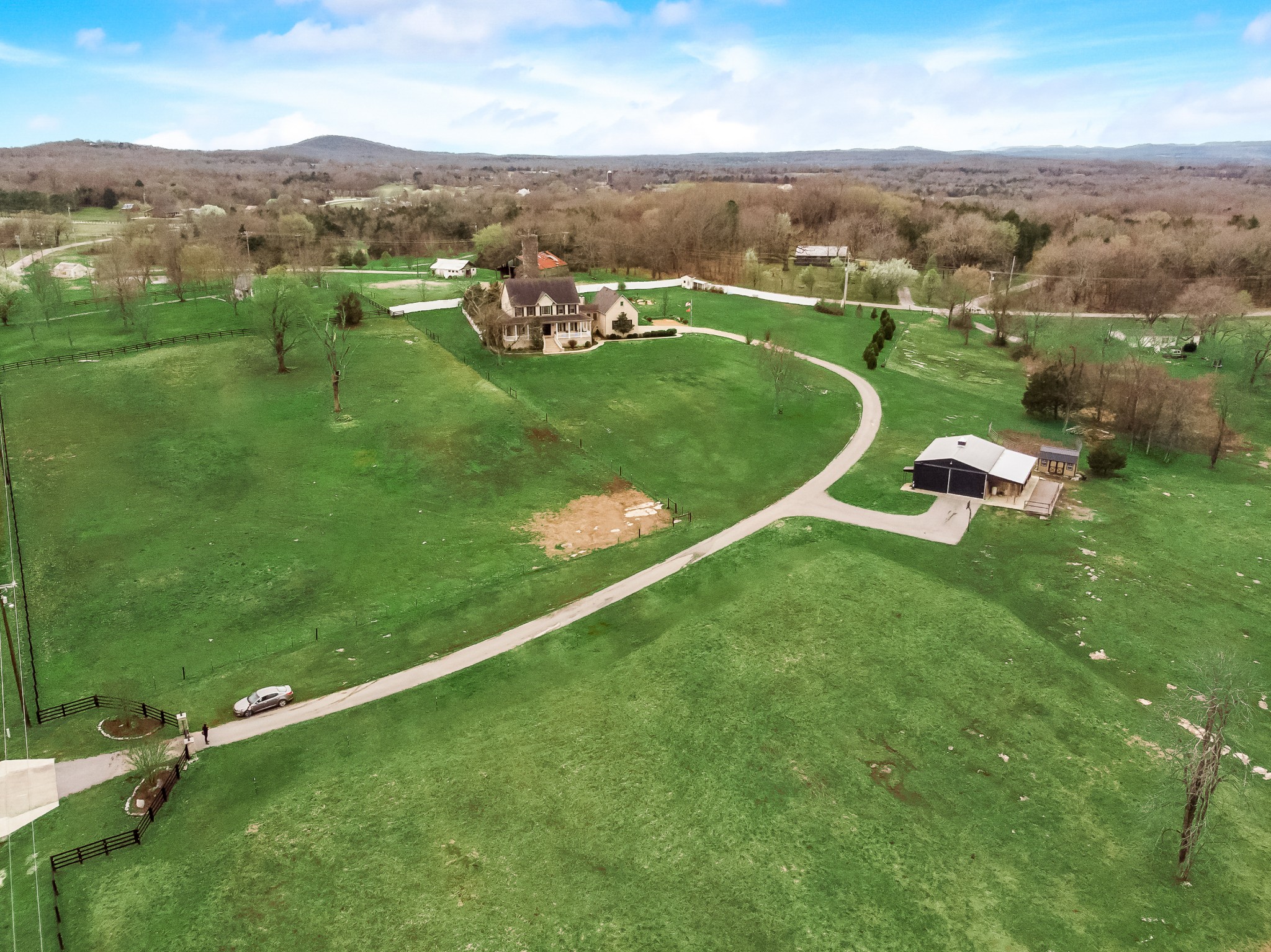 10900 Versailles Road Rockvale, TN 37153 - Photo 53 of 56 an aerial view of residential houses with outdoor space and trees