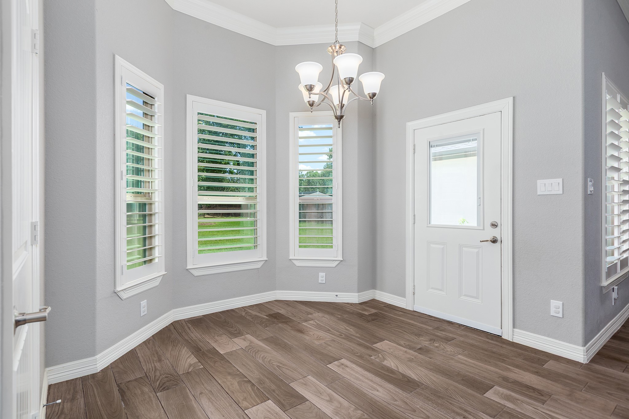 27600 Rio Blanco Drive Splendora, TX 77372 - Photo 20 of 49 a view of a spacious bedroom with windows and chandelier