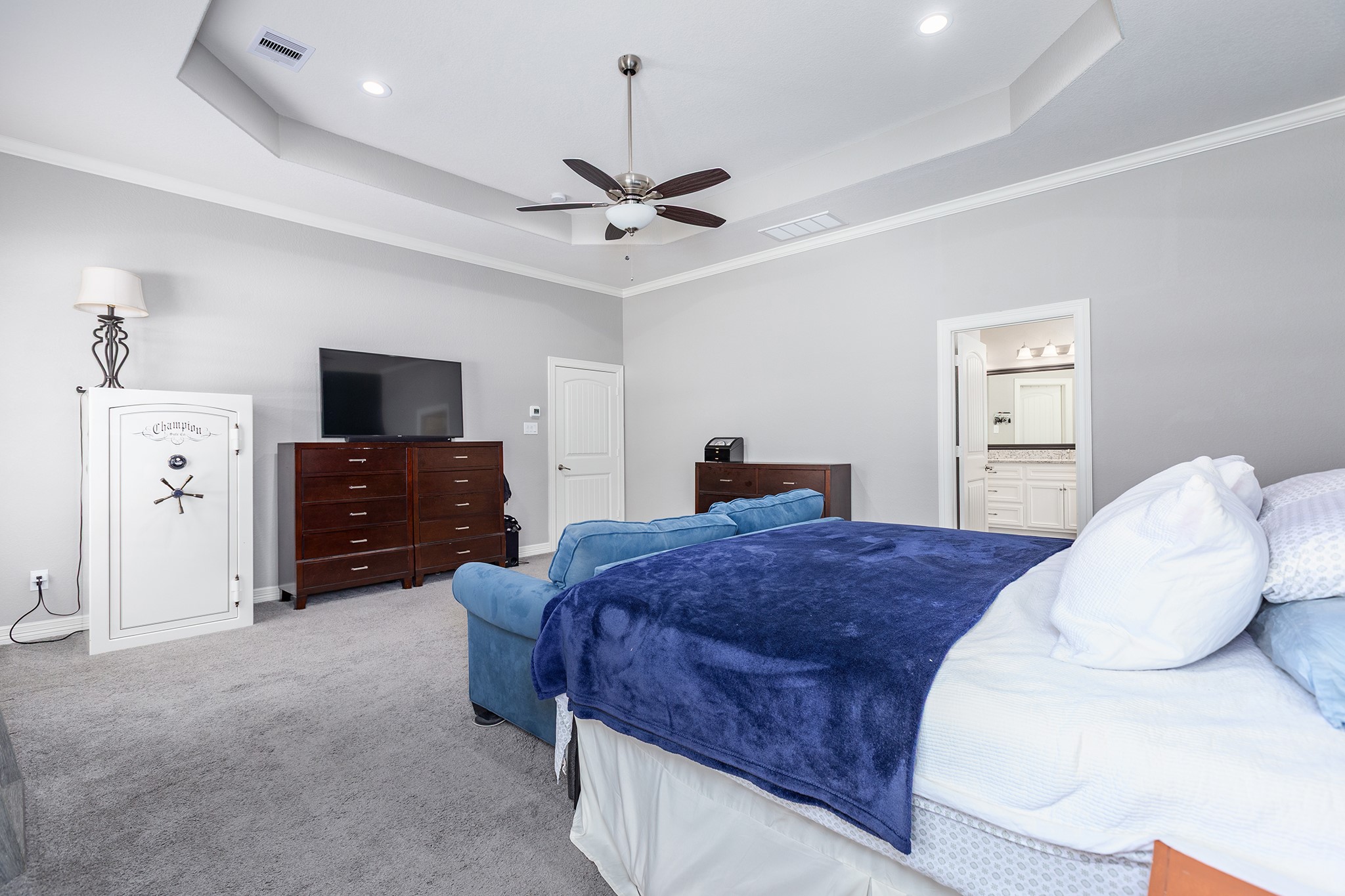 27600 Rio Blanco Drive Splendora, TX 77372 - Photo 23 of 49 a spacious bedroom with a bed and a flat screen tv