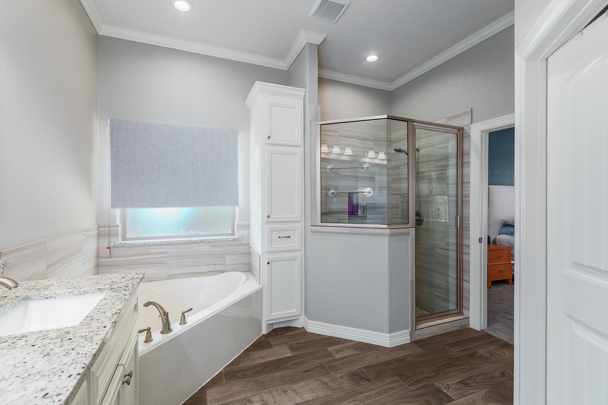 27600 Rio Blanco Drive Splendora, TX 77372 - Photo 24 of 49 a bathroom with a granite countertop sink a bathtub and shower