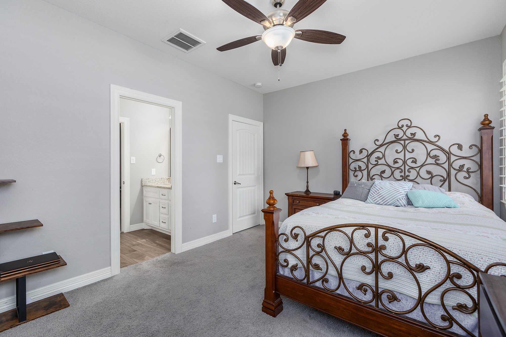 27600 Rio Blanco Drive Splendora, TX 77372 - Photo 32 of 49 a bedroom with a bed and a chandelier