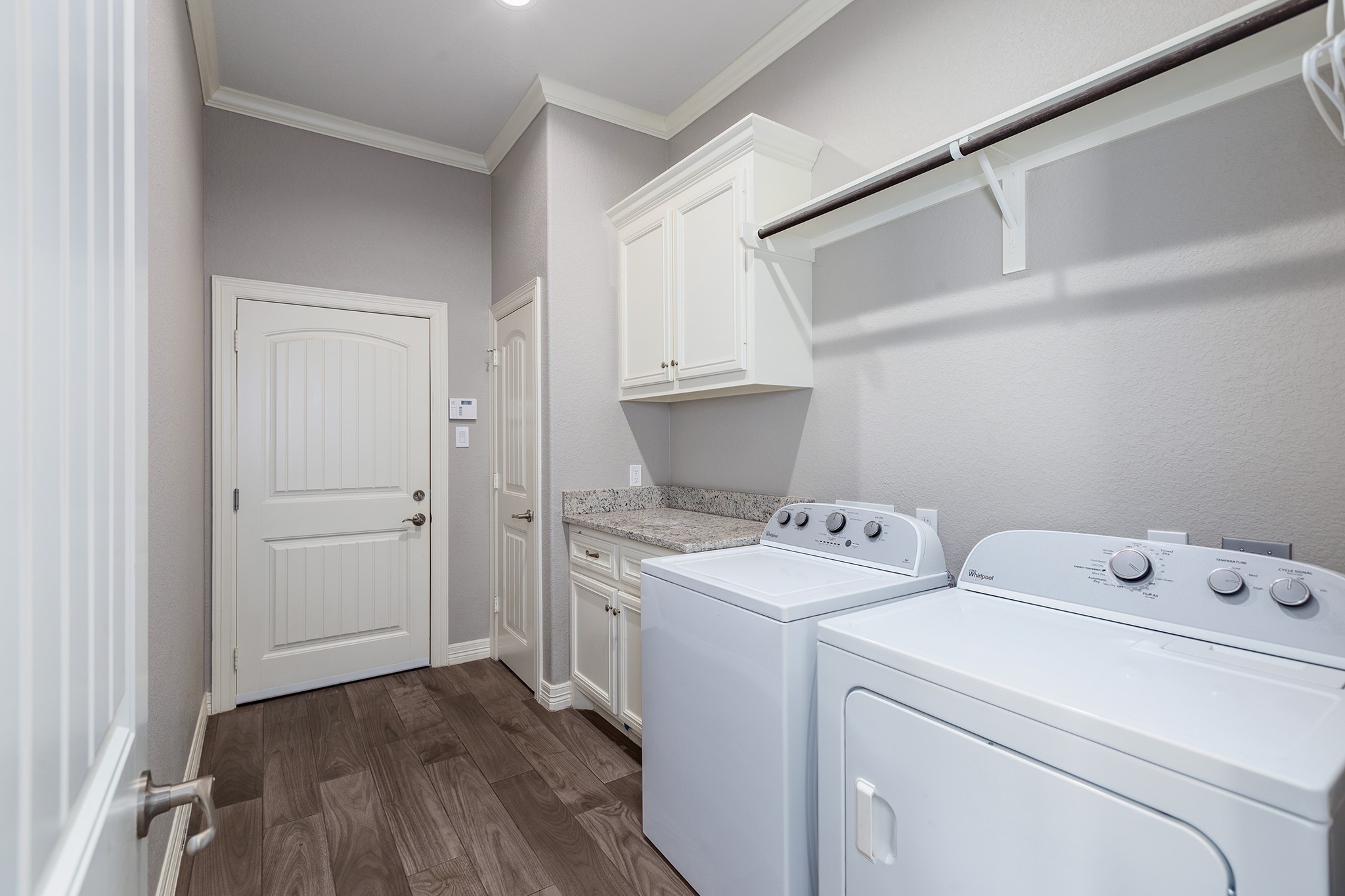 27600 Rio Blanco Drive Splendora, TX 77372 - Photo 33 of 49 a view of washer and dryer with wooden floor