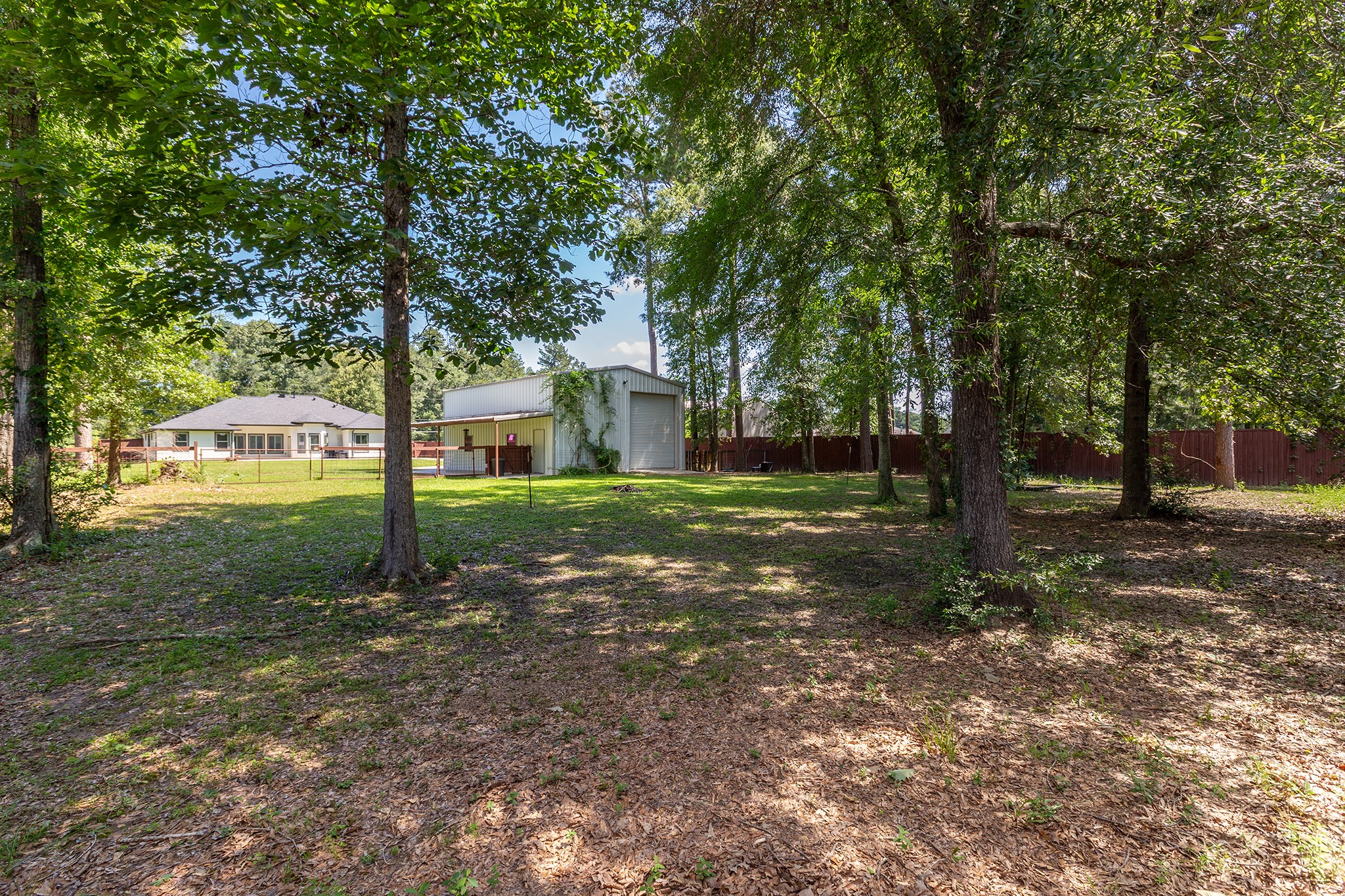 27600 Rio Blanco Drive Splendora, TX 77372 - Photo 42 of 49 a view of a tree in front of a house