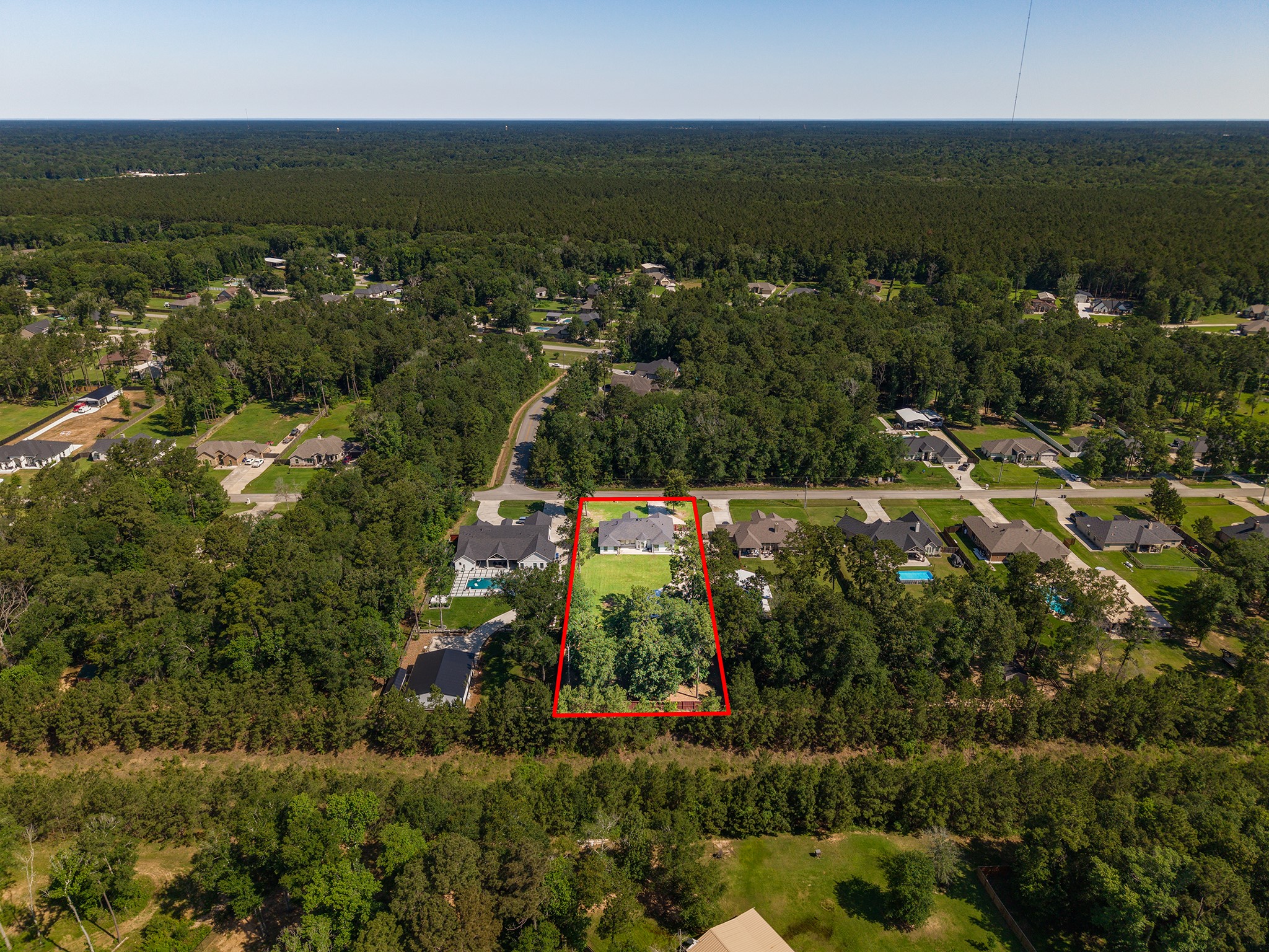 27600 Rio Blanco Drive Splendora, TX 77372 - Photo 44 of 49 an aerial view of residential houses with outdoor space and trees