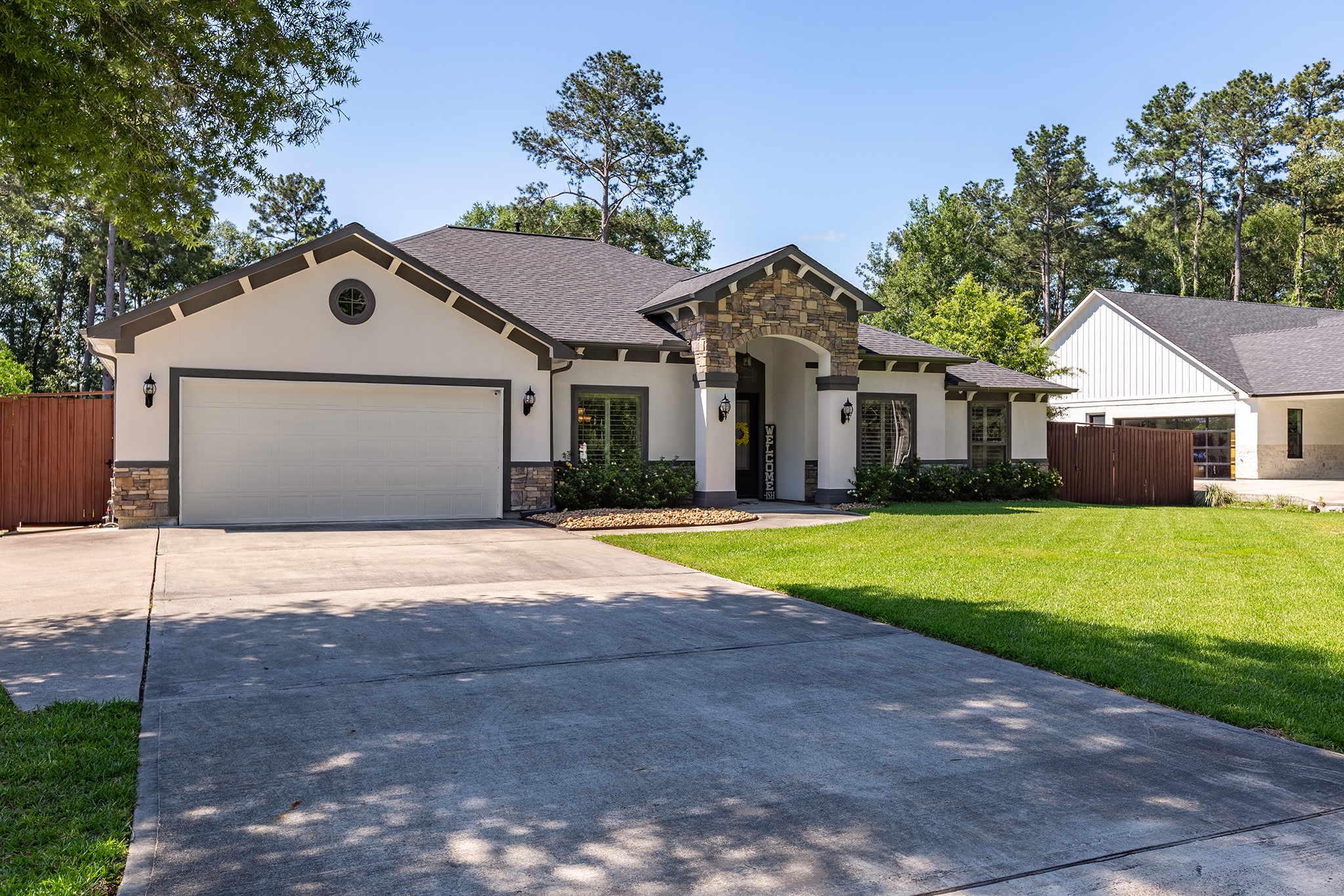 27600 Rio Blanco Drive Splendora, TX 77372 - Photo 47 of 49 a front view of a house with a yard and garage