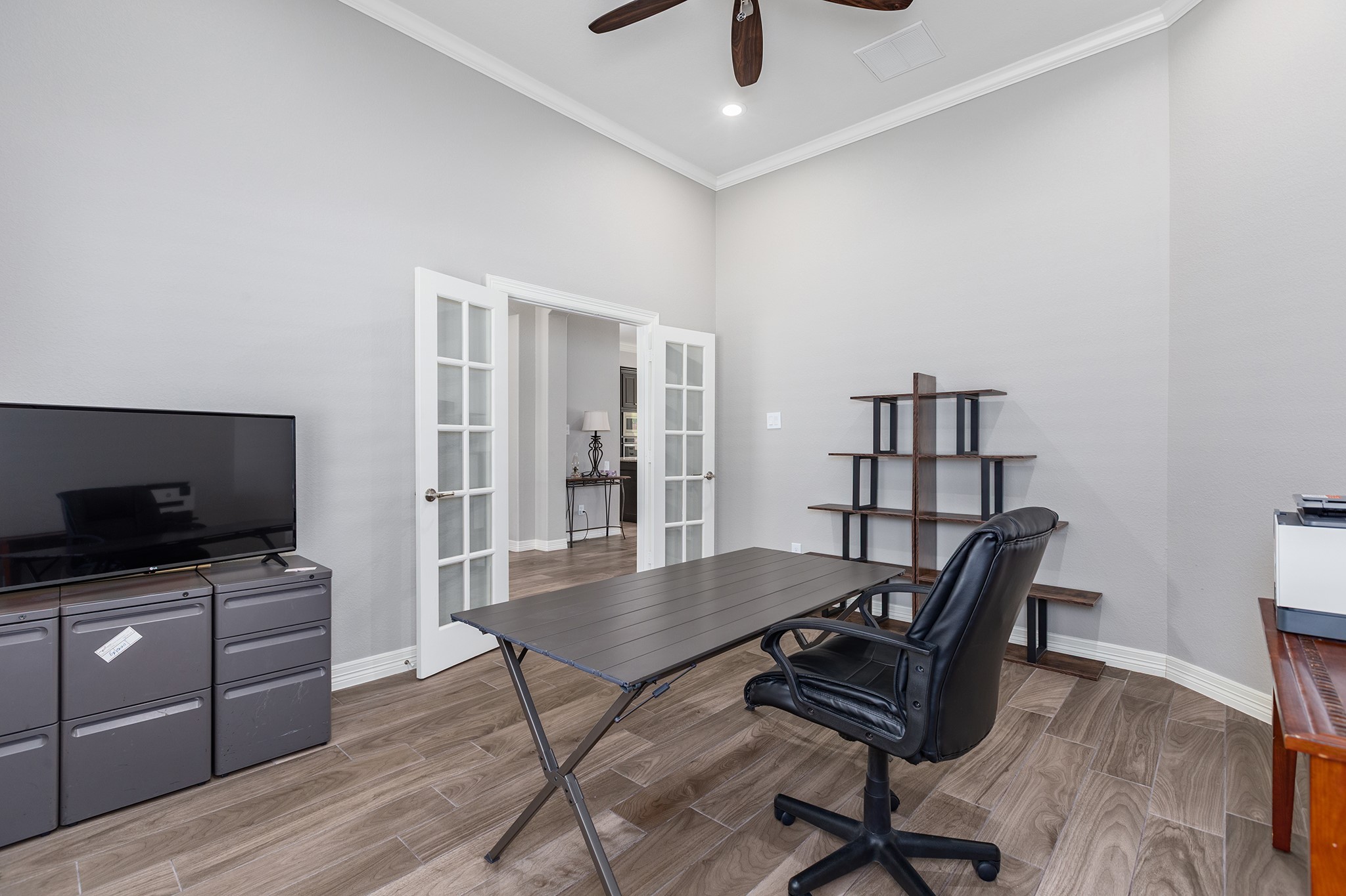 27600 Rio Blanco Drive Splendora, TX 77372 - Photo 7 of 49 a view of a workspace with furniture and wooden floor