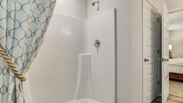 a bathroom with a bathtub and shower