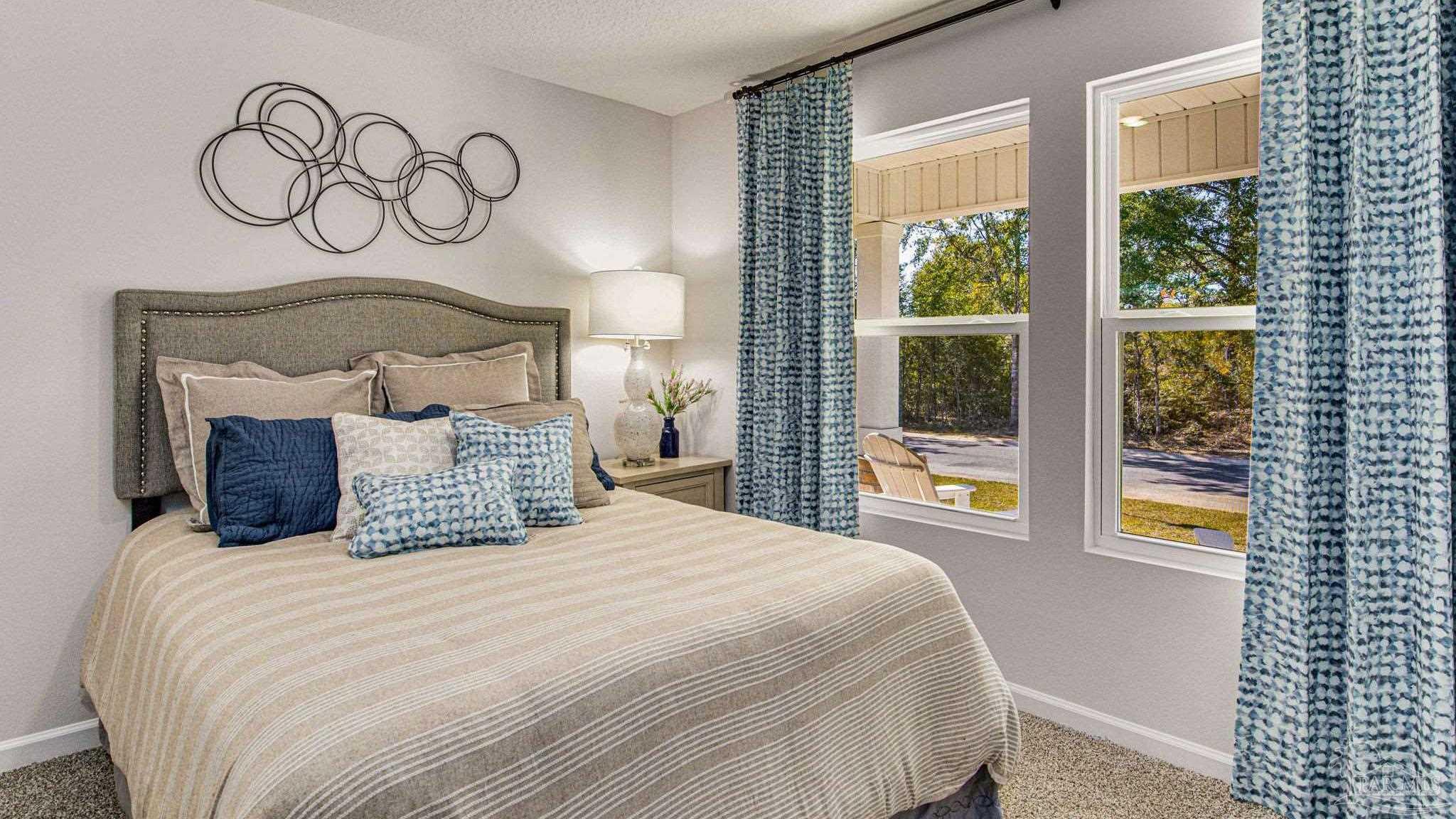 9732 Dutton Lane Milton, FL 32583 - Photo 21 of 24 a bedroom with a large bed and a window