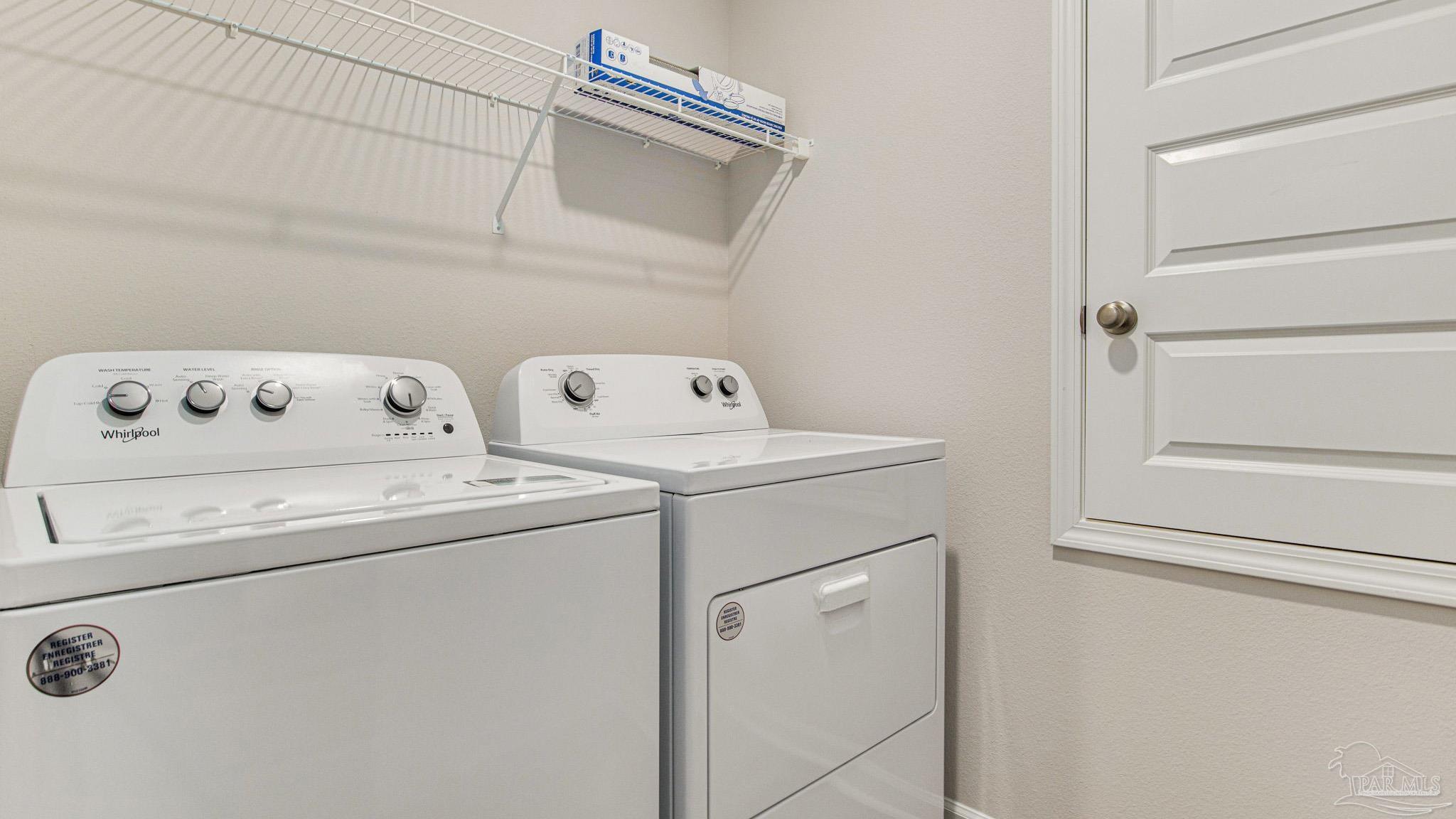 9732 Dutton Lane Milton, FL 32583 - Photo 24 of 24 a utility room with dryer and washer