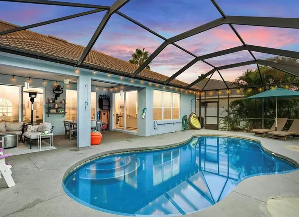 a view of a swimming pool with a patio