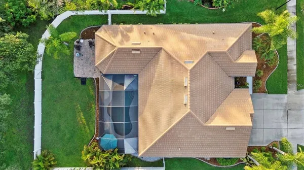 an aerial view of residential houses with outdoor space