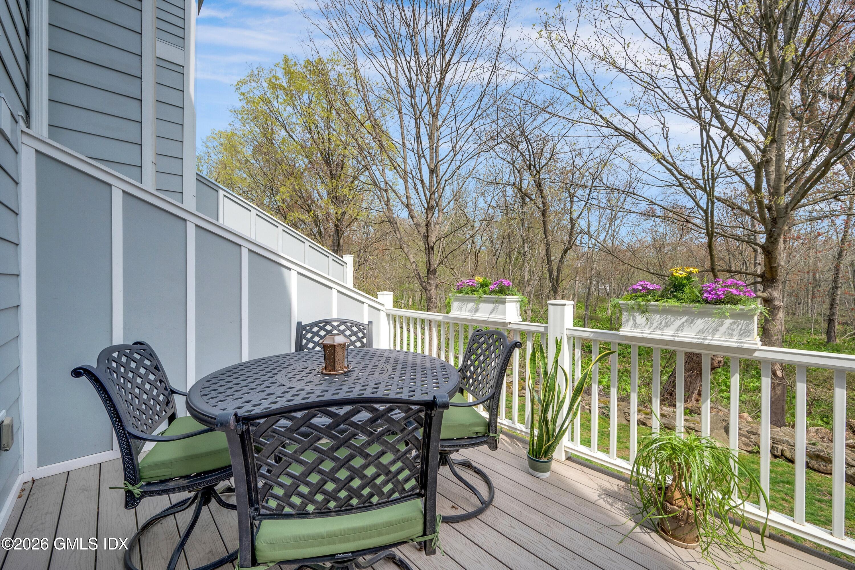 58 Stirrup Lane, Unit 58 Riverside, CT 06878 - Photo 7 of 23 a view of balcony with furniture and trees