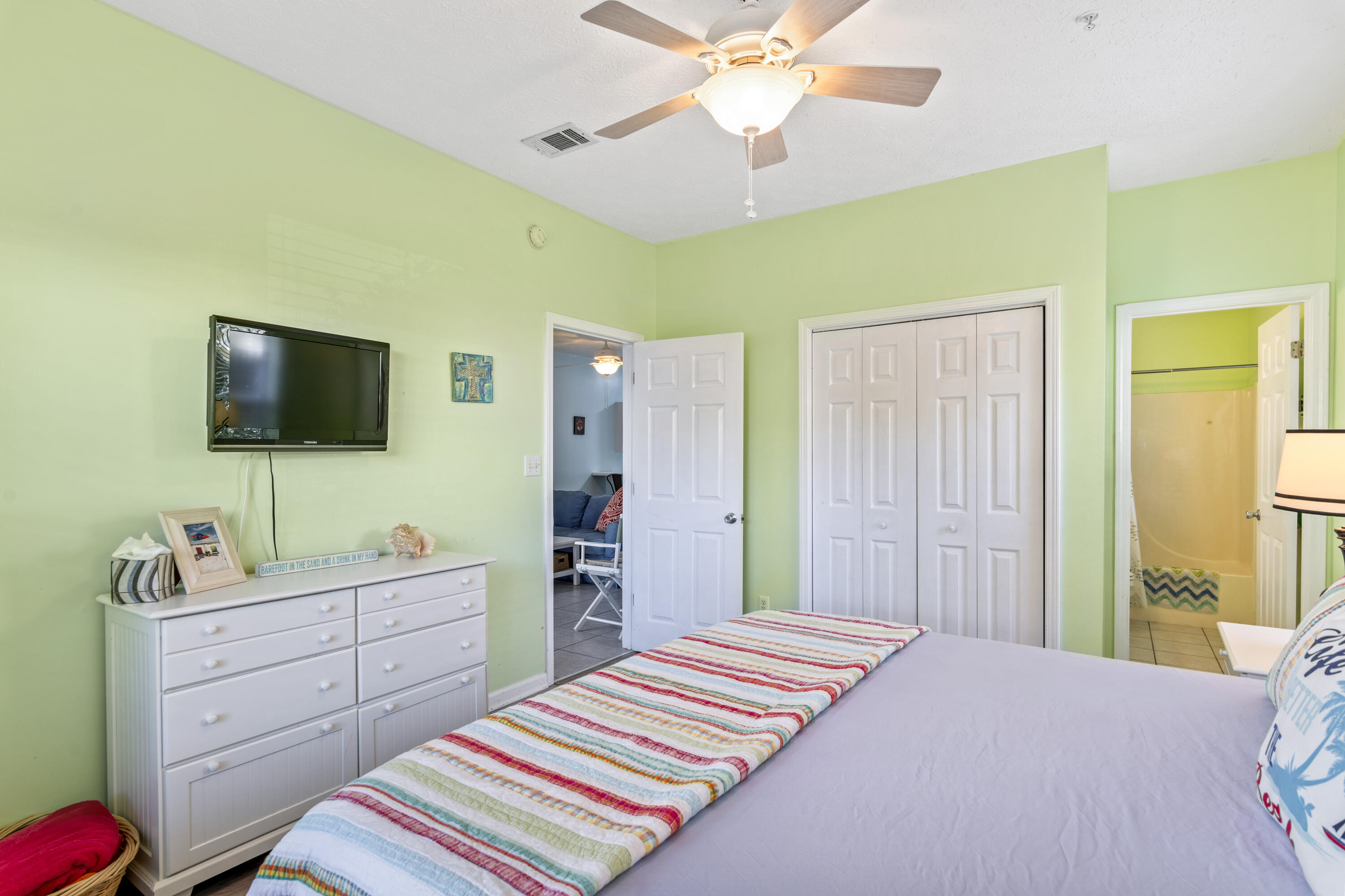 34 Heron's Watch Way, Unit 2104 Santa Rosa Beach, FL 32459 - Photo 15 of 24 a bedroom with a bed and a flat screen tv