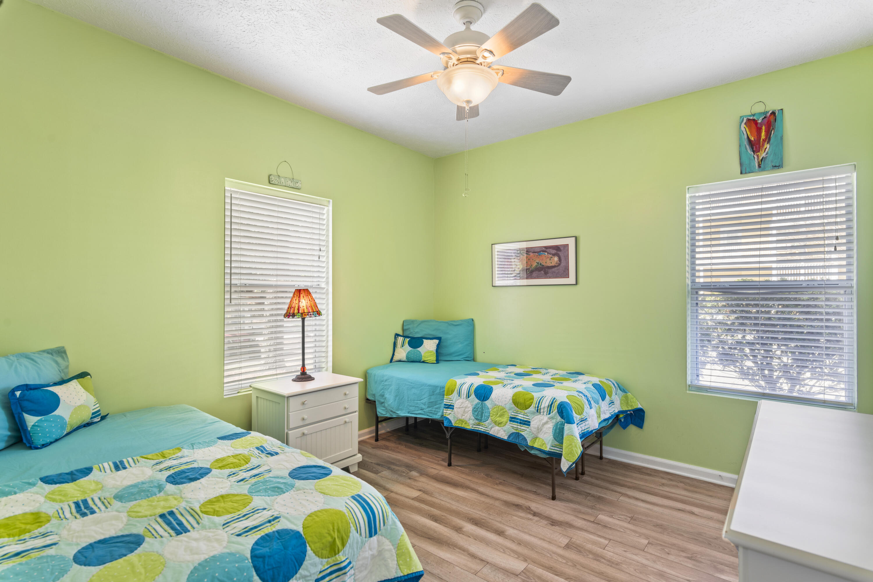34 Heron's Watch Way, Unit 2104 Santa Rosa Beach, FL 32459 - Photo 18 of 24 a bedroom with a bed and a window