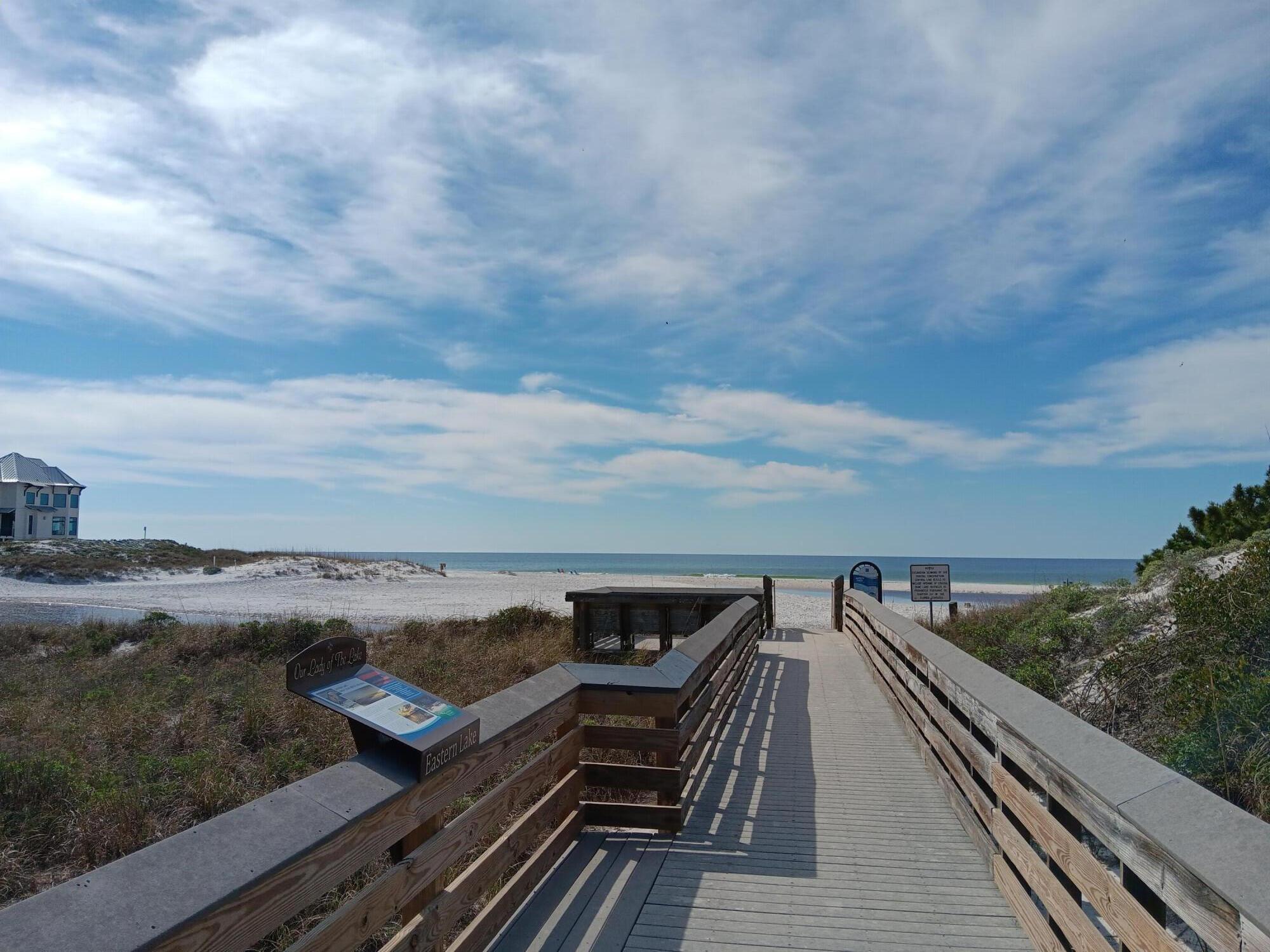 34 Heron's Watch Way, Unit 2104 Santa Rosa Beach, FL 32459 - Photo 23 of 24 a view of roof deck with two chairs and wooden floor
